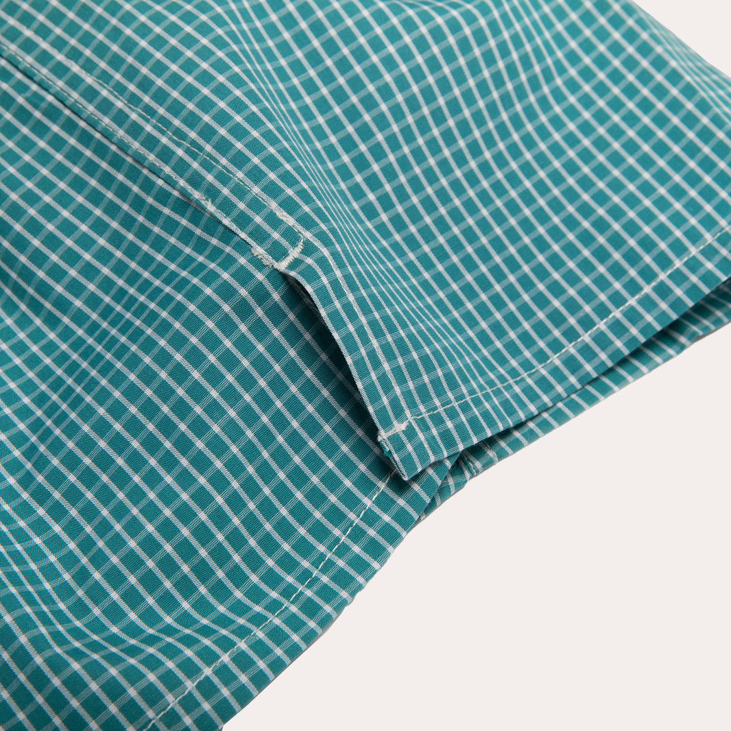 Green upcycled boxer shorts with small white checks