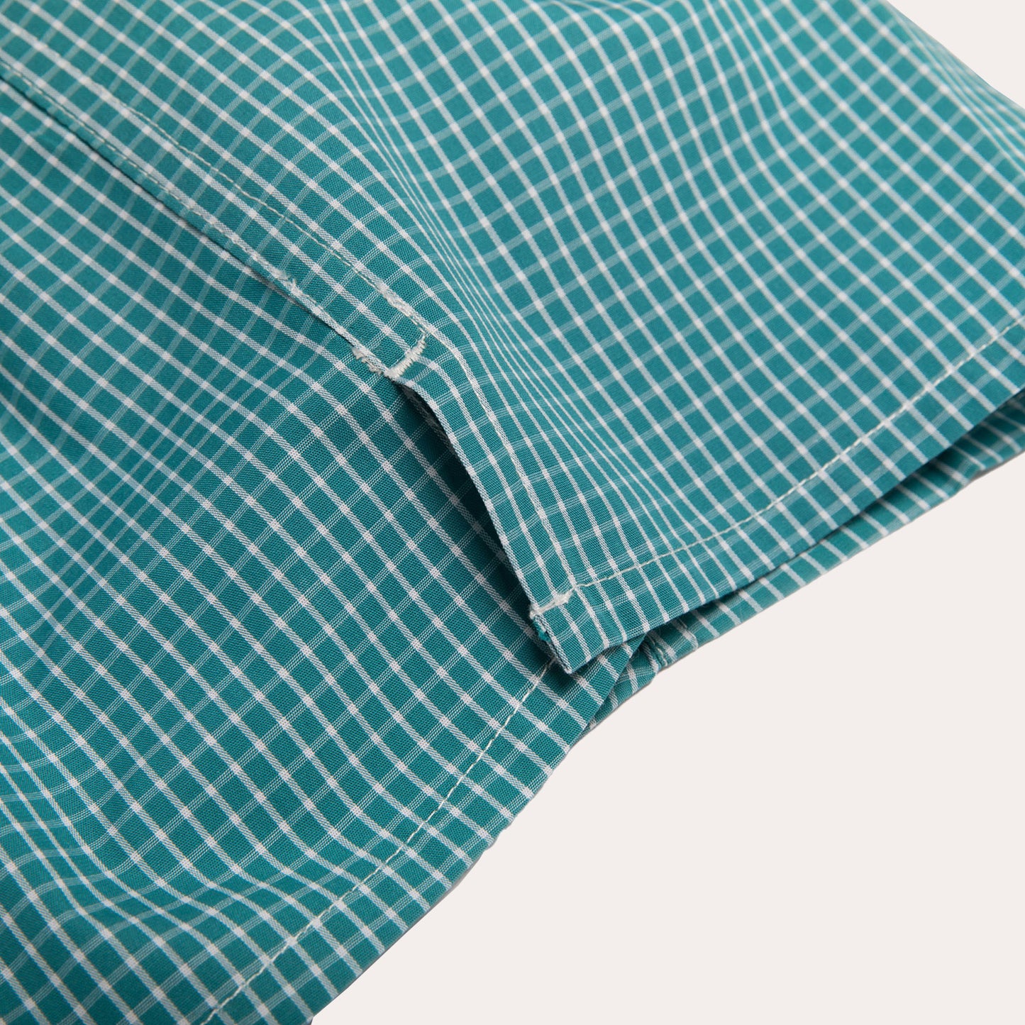 Green upcycled boxer shorts with small white checks