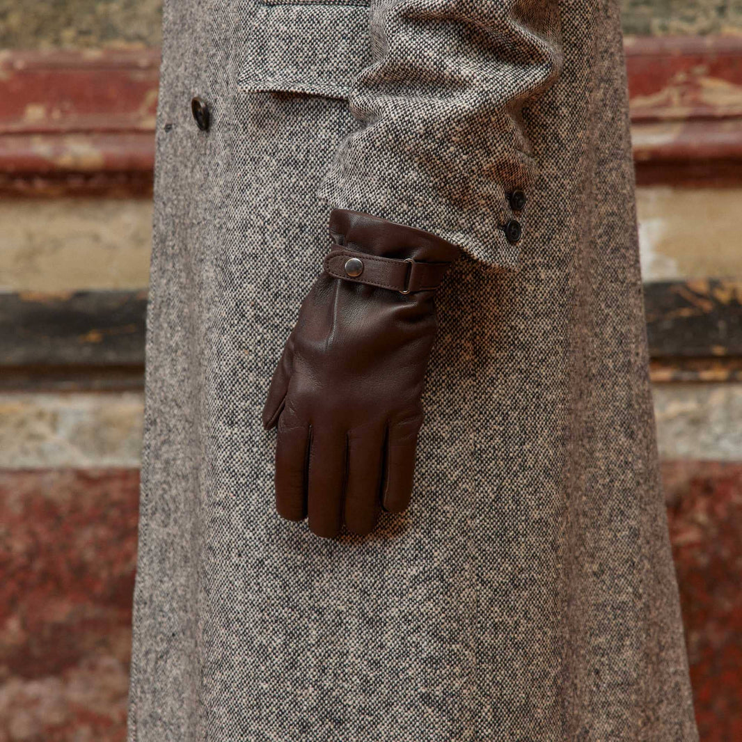 Brown leather gloves with tightening tab