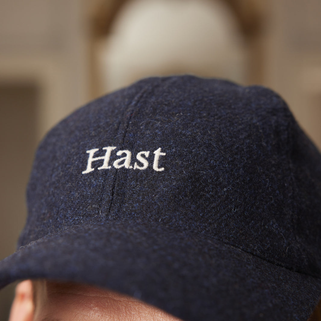 Ecru embroidered navy wool cap